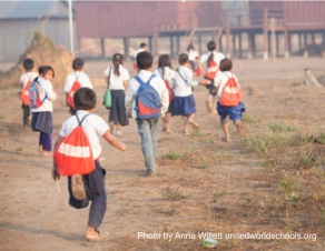 Children on their way to school with their UWS Schoolbags, Ol Thom village, Cambodia (photo by Anna Willett)