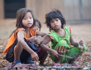 Girl on boat by the river, Som Village, Cambodia (Photo by Anna Willett) unitedworldschools org